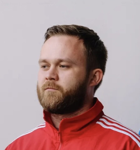 Ivan — vocals and guitar of 5051, red Adidas jacket